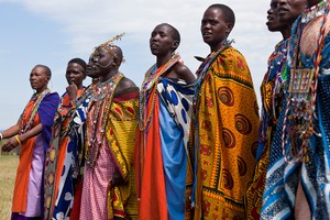 Masai women singing and dancing in a primitive village in the Masai Mara region of southwestern Kenya.
